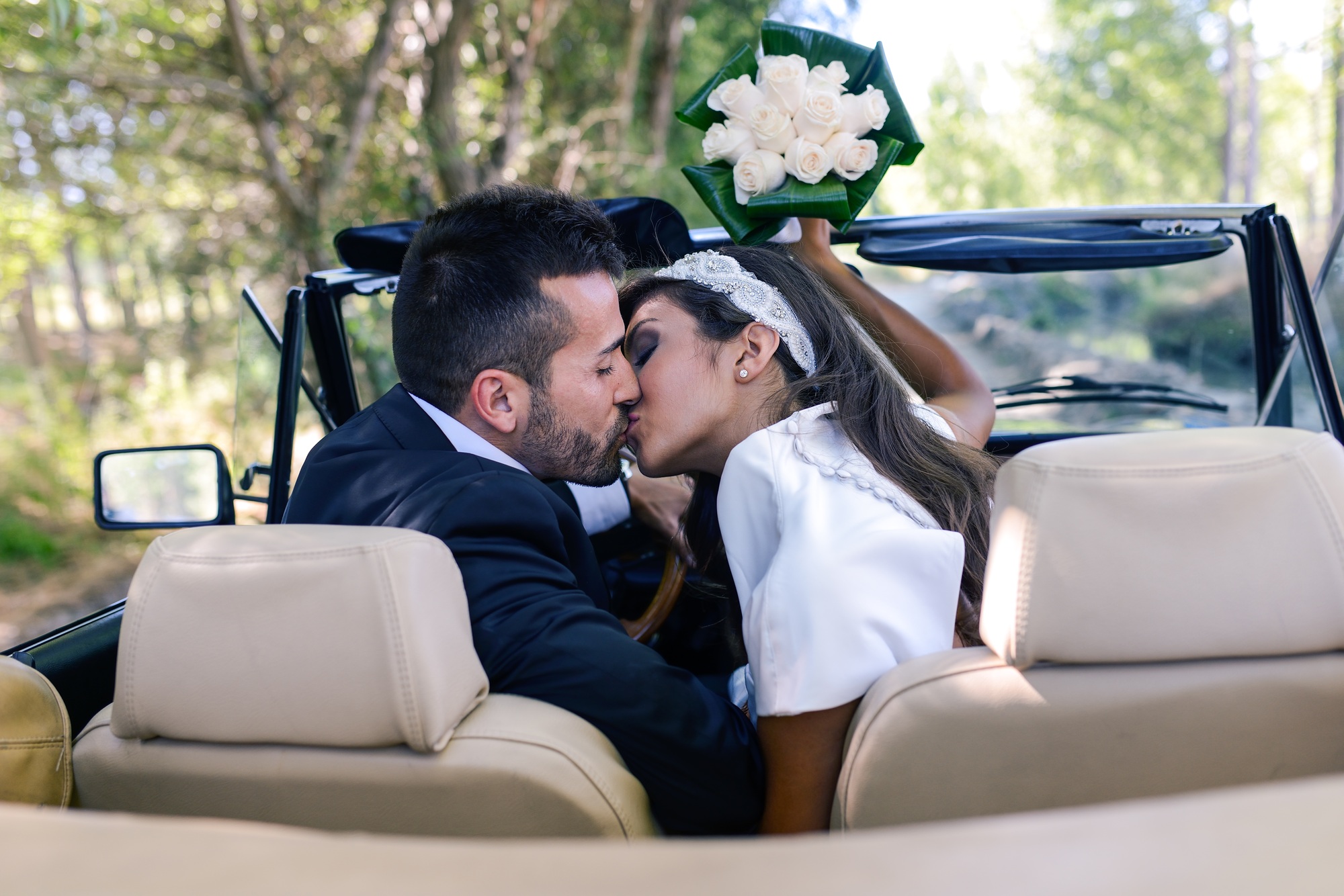 Just married couple in an old car